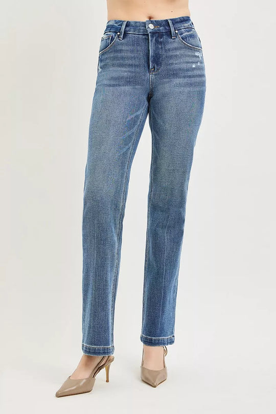 Medium wash straight-leg jeans with cuffed hem, whiskering, button closure