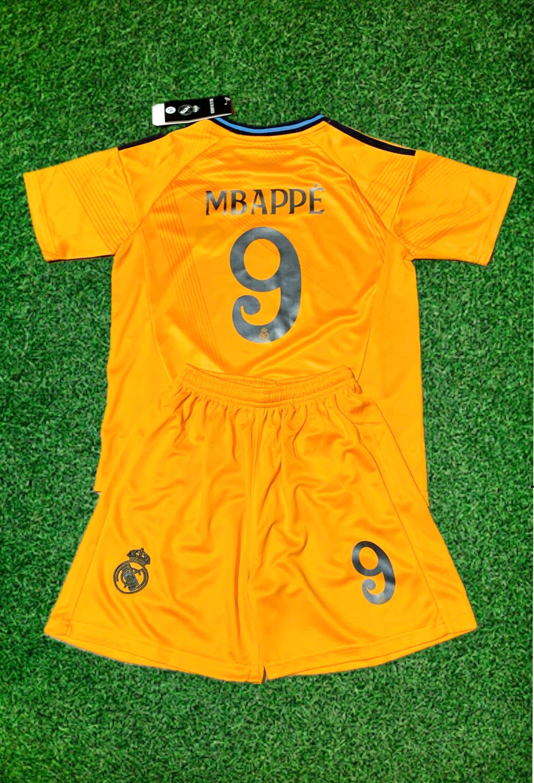 Orange soccer jersey and shorts set with MBAPPE 9 and Real Madrid crest