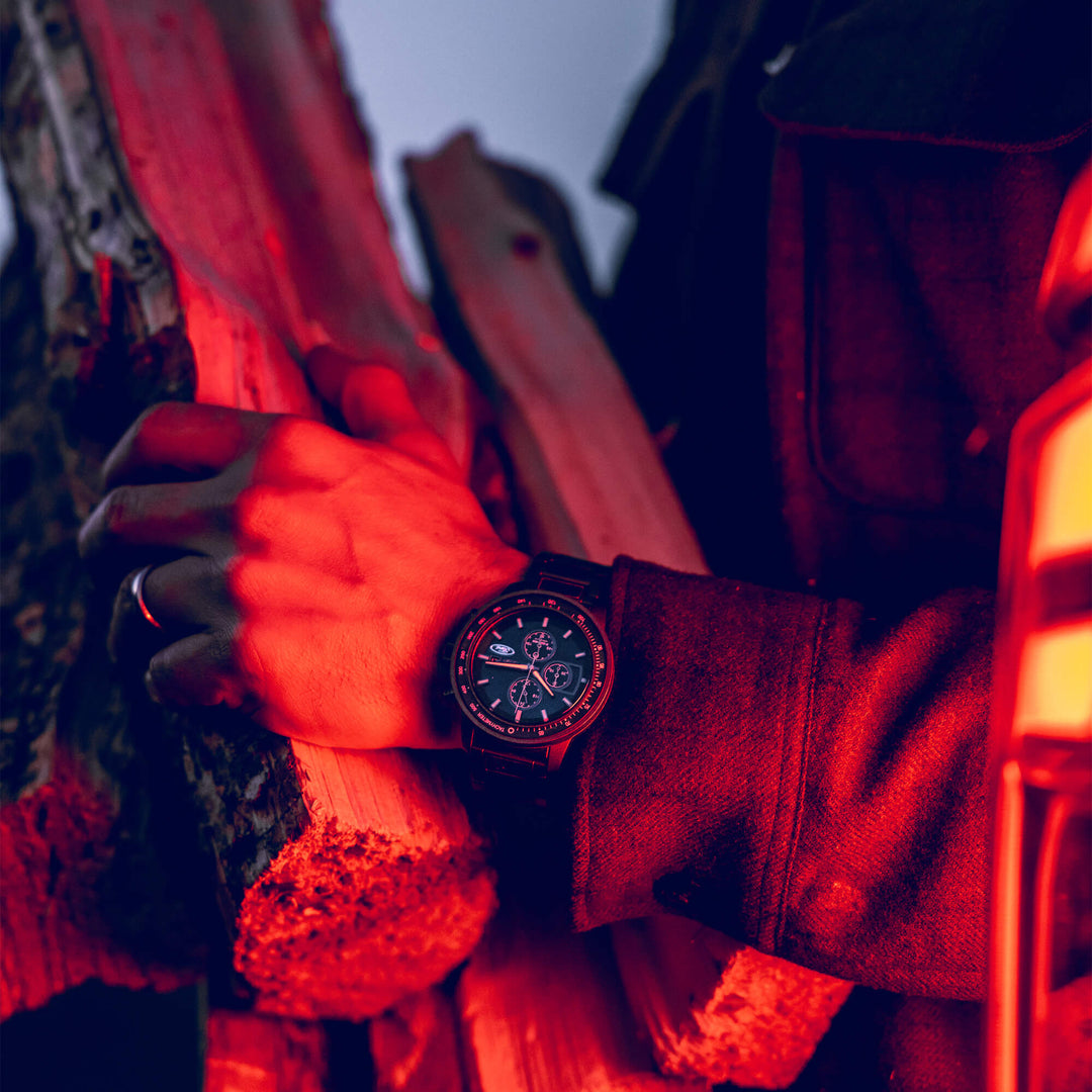 Ford Barrel Chrono 45mm wristwatch, blue chronograph face and gray band in low light