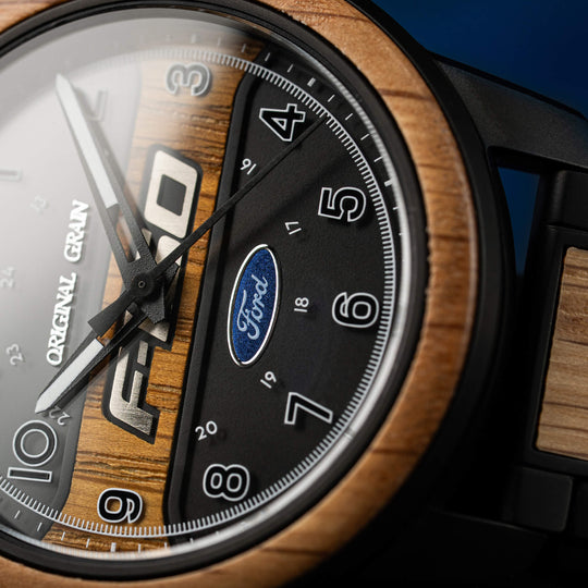 Ford Barrel 44 mm dial close-up with Ford logo, gold hands, black numerals and wood edge