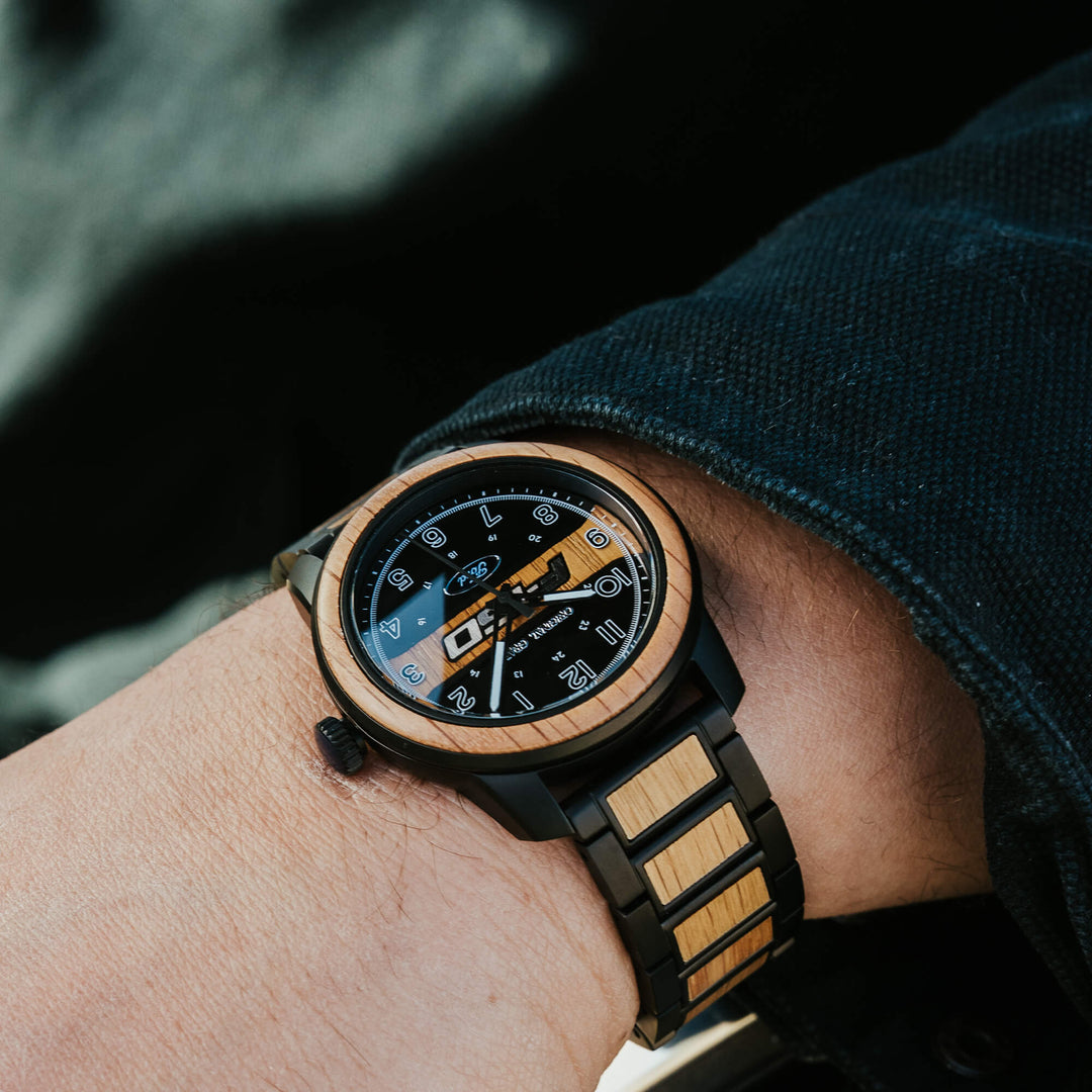 Ford Barrel 44 mm watch close-up on wrist, blue dial accents and black wood-inlay bracelet