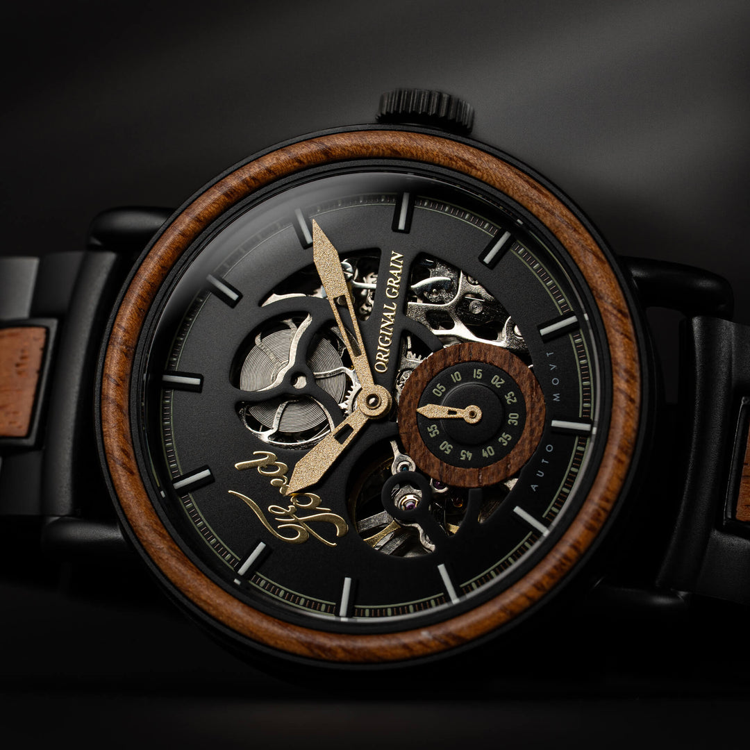 Automatic 40mm watch face close-up with skeleton gears, black dial, and wood bezel