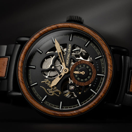 Automatic 40mm watch face close-up with skeleton gears, black dial, and wood bezel