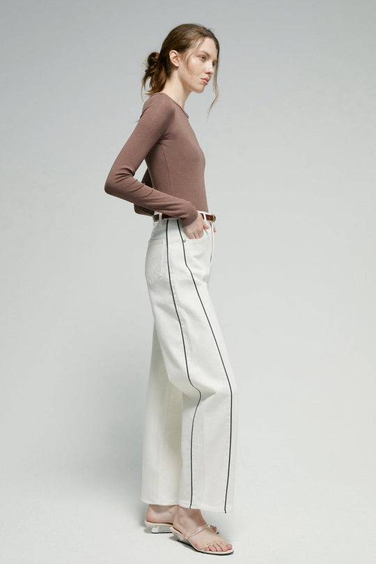 White ankle jeans with contrast vertical seam piping, belt loops and front button