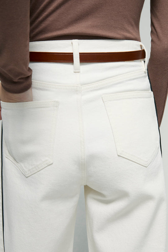 Back waist close-up: white ankle jeans with belt loops and stitched back pockets