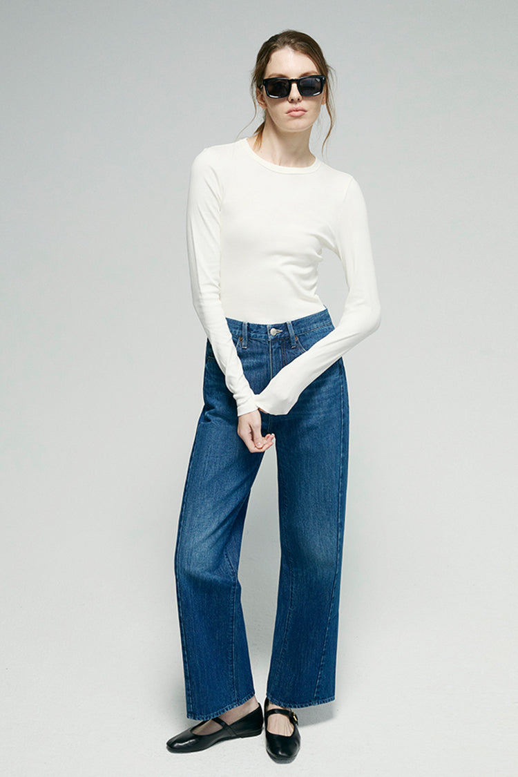 Blue denim ankle jeans with wide leg, front button closure, and front pockets