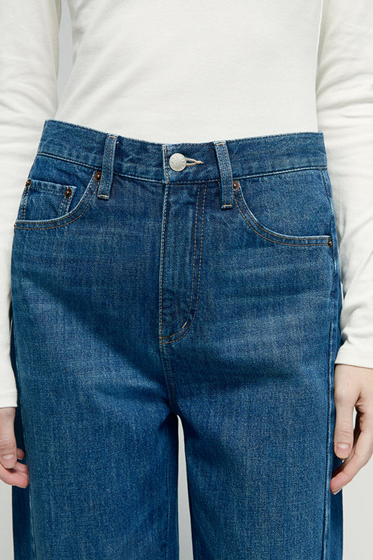 Blue denim ankle jeans waistband with button closure and belt loops