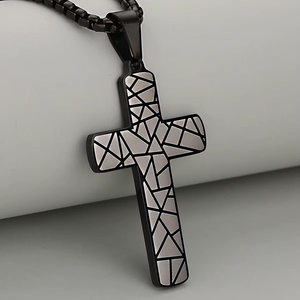 Geometric Cross Necklace: black geometric cross pendant with white mosaic on cord