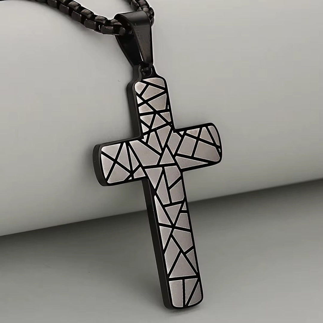 Geometric Cross Necklace: black geometric cross pendant with white mosaic on cord