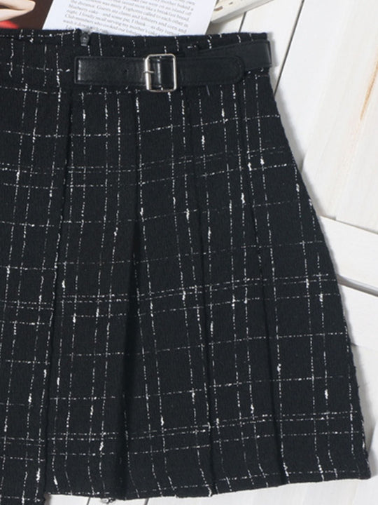 Black pleated plaid mini skirt with silver buckle belt and vertical pleat lines