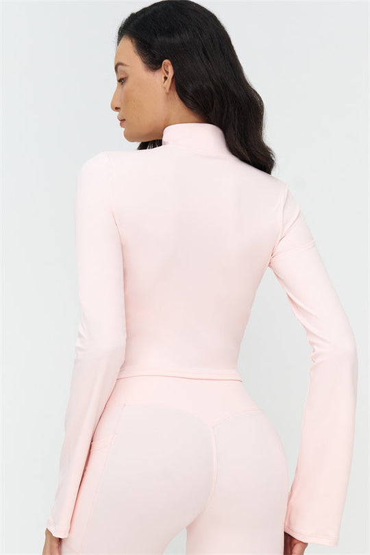 Oyster Pink back view: long-sleeve zip jacket and flared leggings, light pink