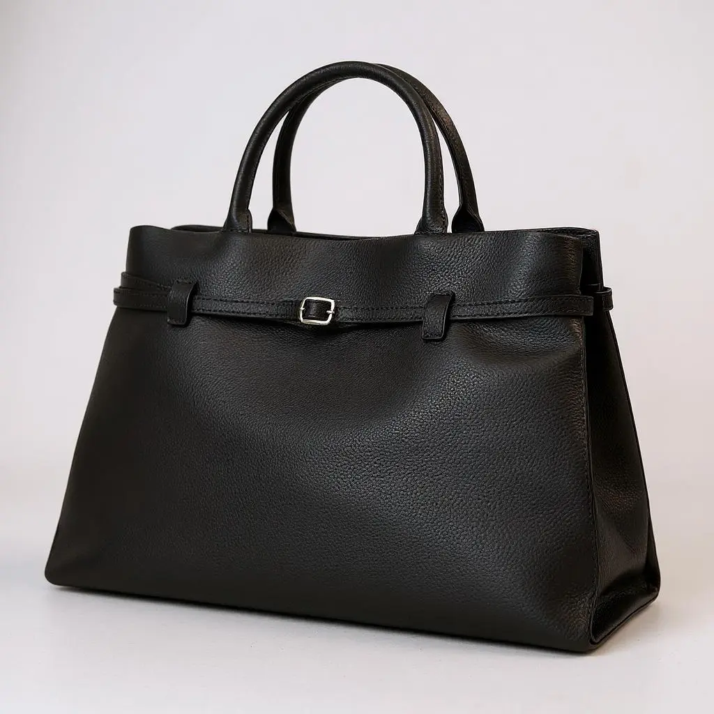 THE XL Sarah Large belt tote bag in black, front belt strap with buckle detail, roomy tote shape.