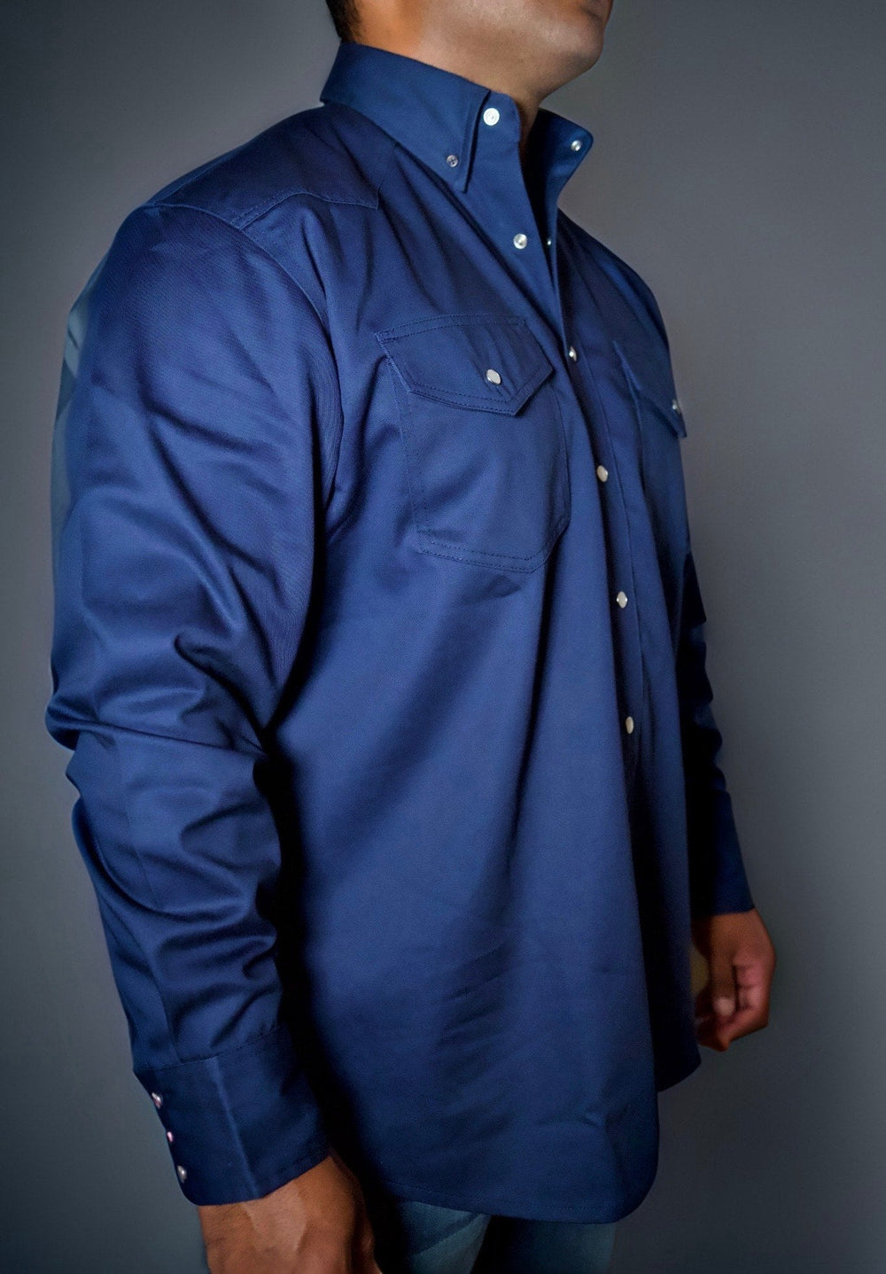 Navy FR western shirt with pearl snap placket, chest pockets, and shoulder tab