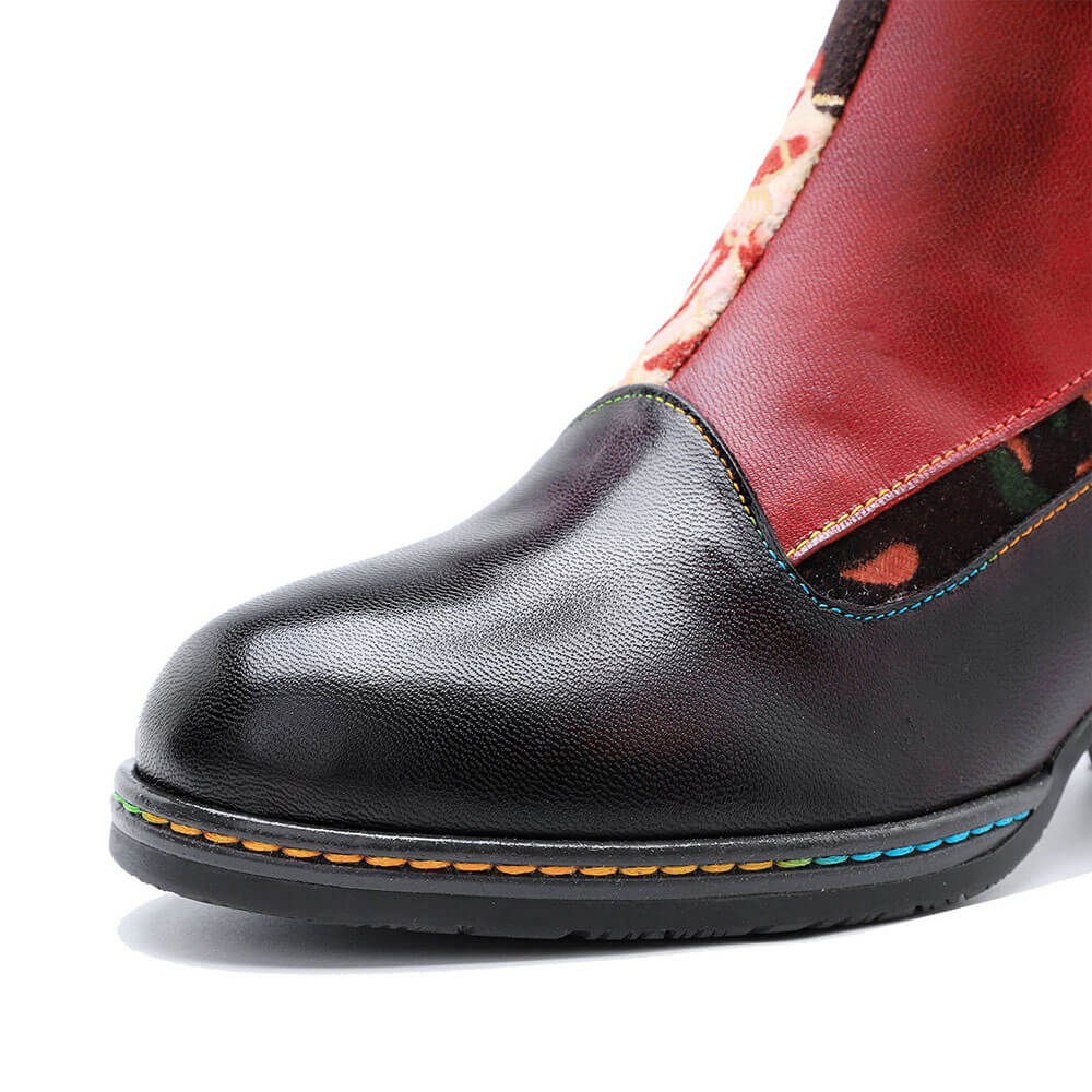 Black leather boot toe with colorful stitch trim and cushioned sole edge