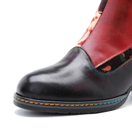 Black leather boot toe with colorful stitch trim and cushioned sole edge