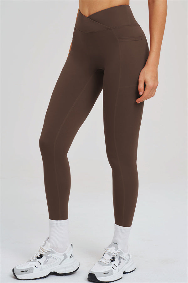 Taupe leggings close-up showing front seam details and contoured waistband