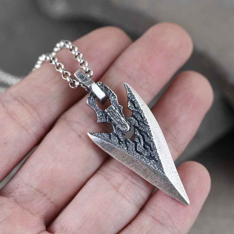 Silver weapon-shaped pendant necklace on chain, dagger design with dark accents
