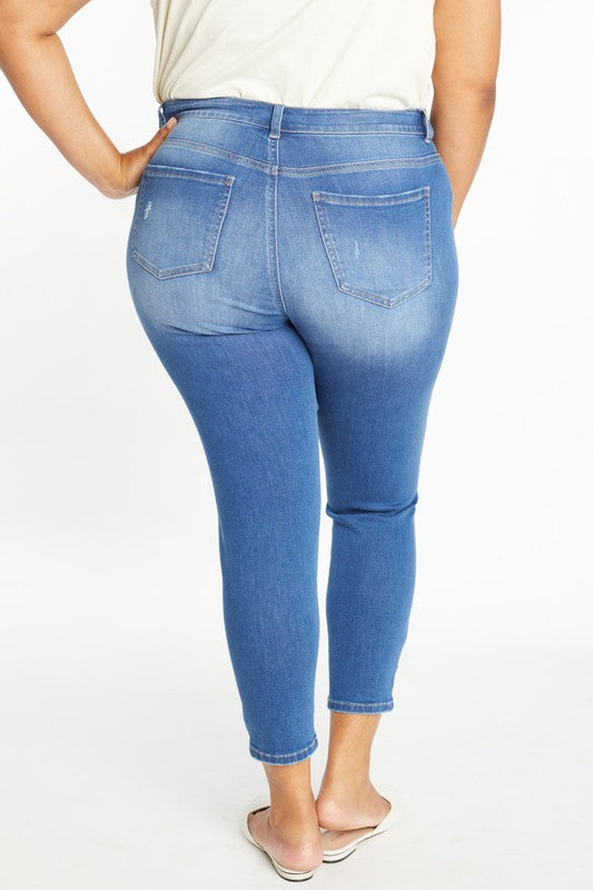 Curvy destructed ankle skinny jean, medium wash with back pockets and straight ankle hem