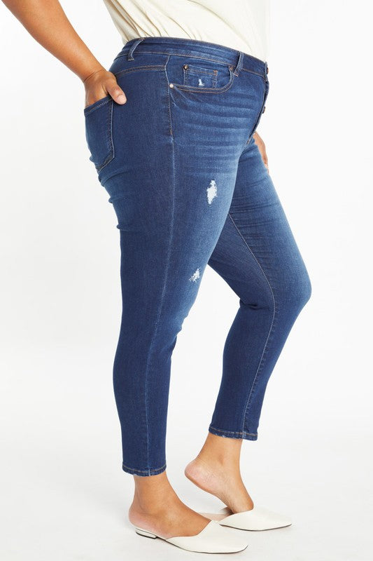 Curvy destructed ankle skinny jean, medium-blue wash with ripped details on back pocket