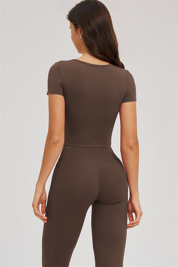 Taupe 2-piece set: back view of fitted crop tee and high-rise leggings