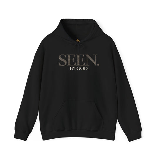 Black hoodie front view with SEEN. by God chest print and drawstring hood