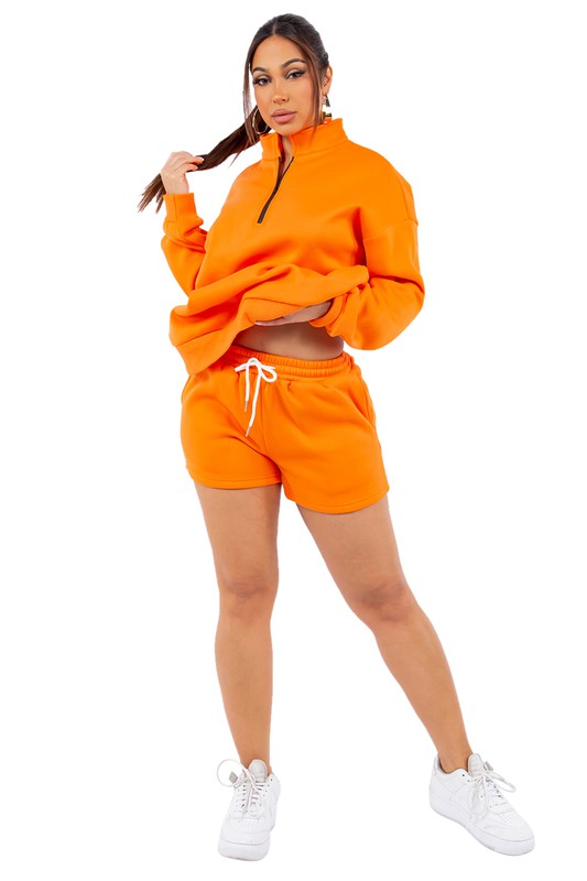 Orange women’s hoodie and shorts set, half-zip pullover with drawstring waistband