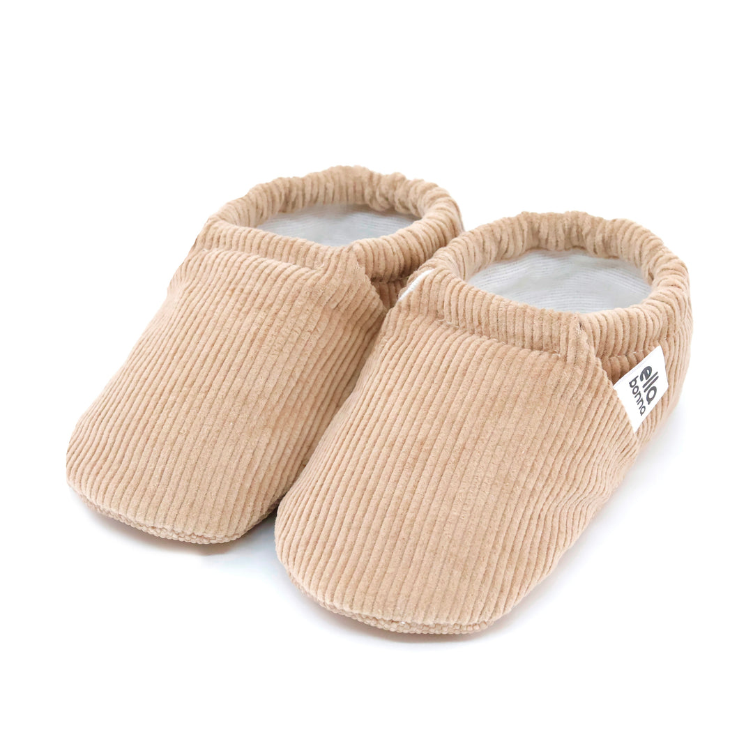 Beige corduroy baby moccasin shoes with elastic cuff, pair view