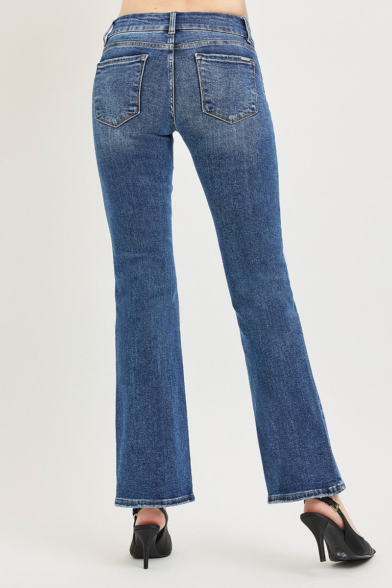 Medium wash low-rise bootcut jeans with two back patch pockets (back view)