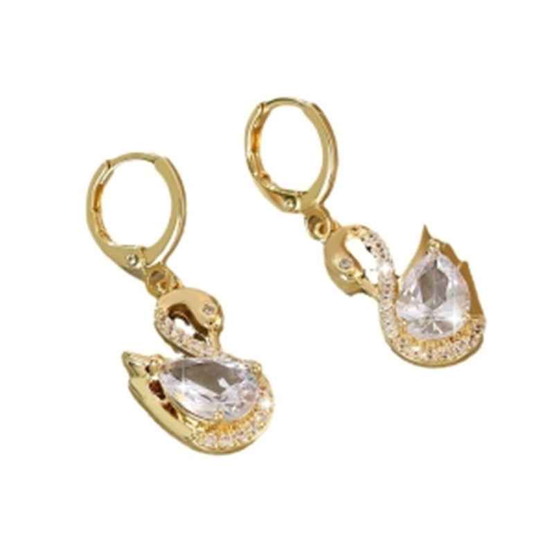 Gold-tone swan hoop earrings with clear rhinestone teardrop center and wing spikes.