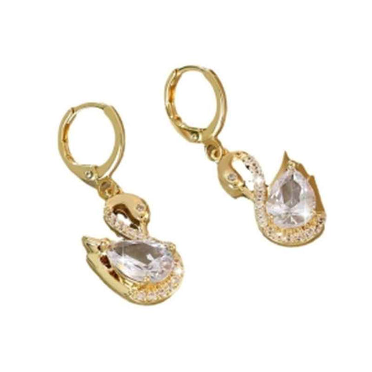 Gold-tone swan hoop earrings with clear rhinestone teardrop center and wing spikes.