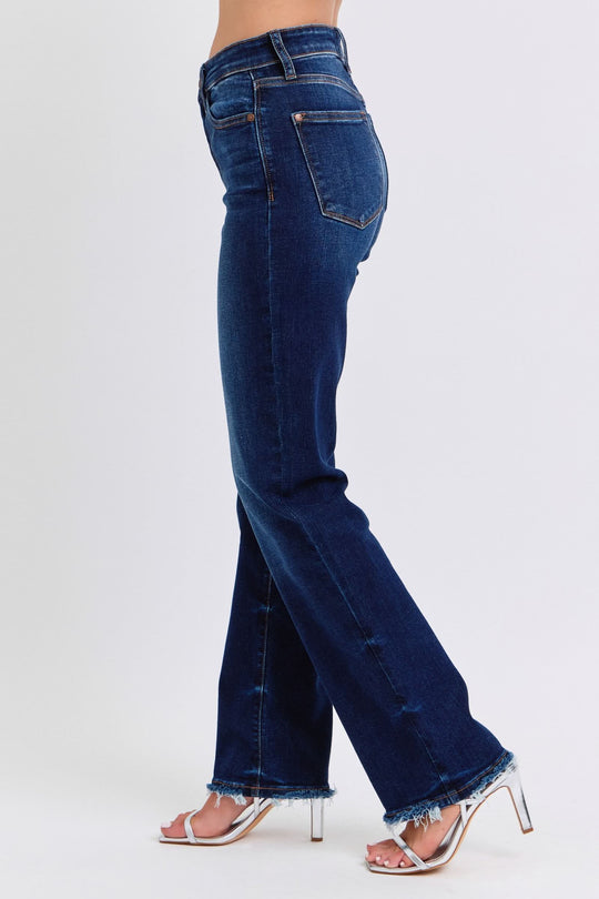Dark straight-leg jeans with raw hem and front pockets, full length