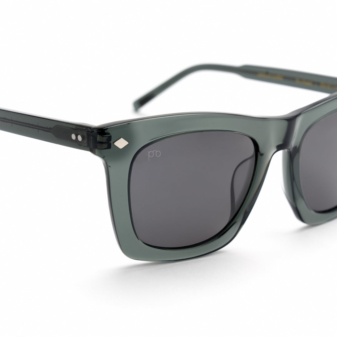 Devlin sunglasses close-up, dark green frame with curved dark lenses