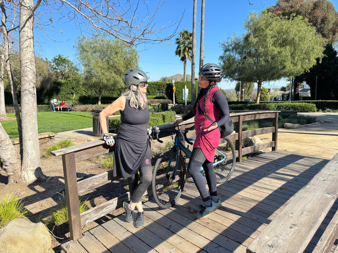 Bike Date Dress: sleeveless black knee-length dress with draped neckline and gathered waist
