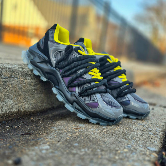 ICON V2 “Shadow” on pavement, light gray upper with black laces and yellow accents