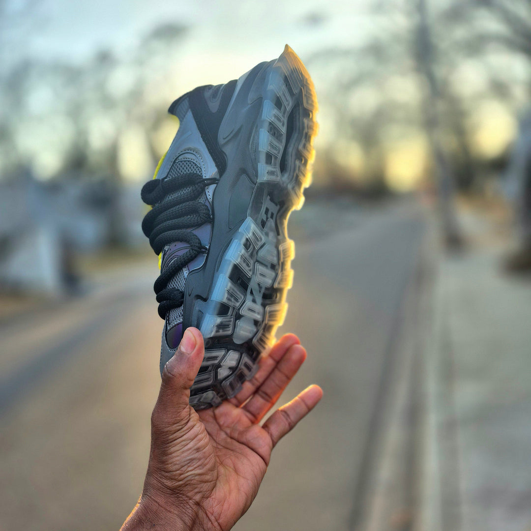 ICON V2 “Shadow” sole view, chunky tread with neon yellow edge