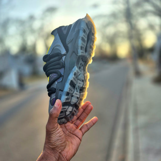 ICON V2 “Shadow” sole view, chunky tread with neon yellow edge