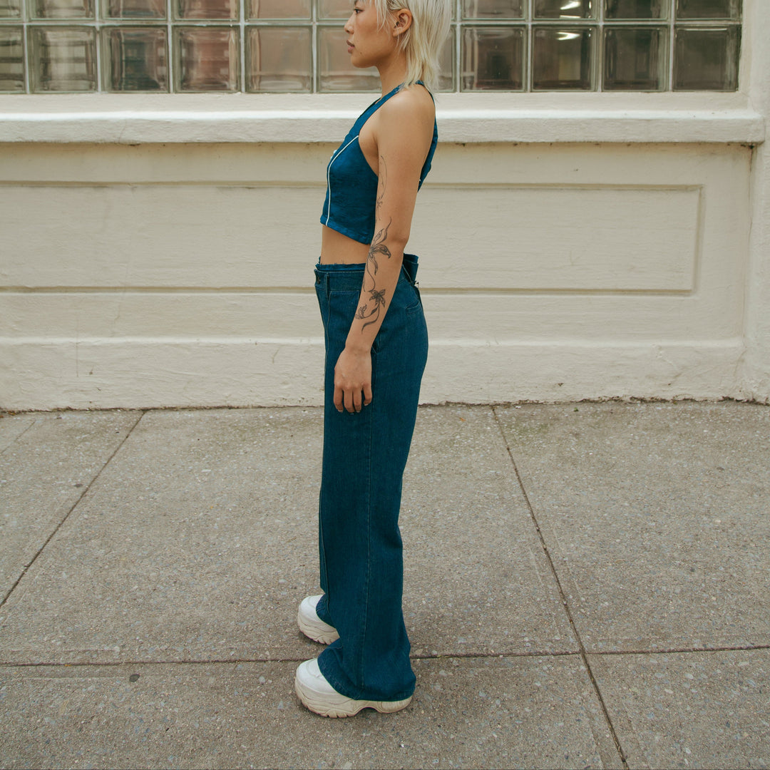 Forest blue sleeveless crop top on a model, side profile showing front keyhole opening