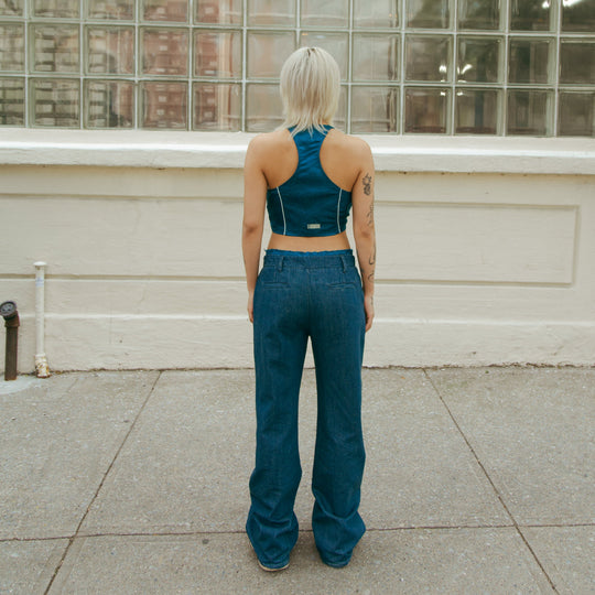 Forest blue sleeveless crop top from behind with keyhole back opening and white piping