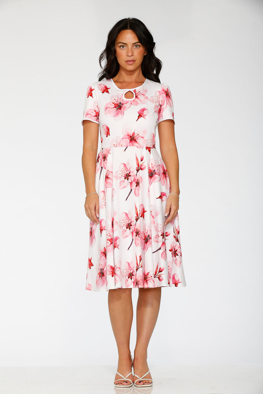 White swing dress with pink/red floral print, keyhole neckline, short sleeves