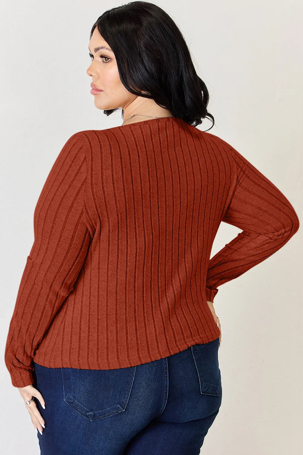 Rust ribbed long-sleeve T-shirt shown from back, long sleeves and ribbed knit