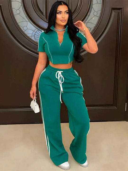 Green zip-up short hoodie crop top with white piping and matching long jogger pants