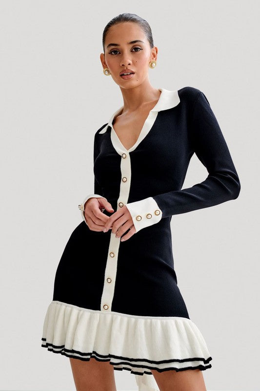 Black sweater mini dress close-up, cream collar and front buttons with striped ruffle hem