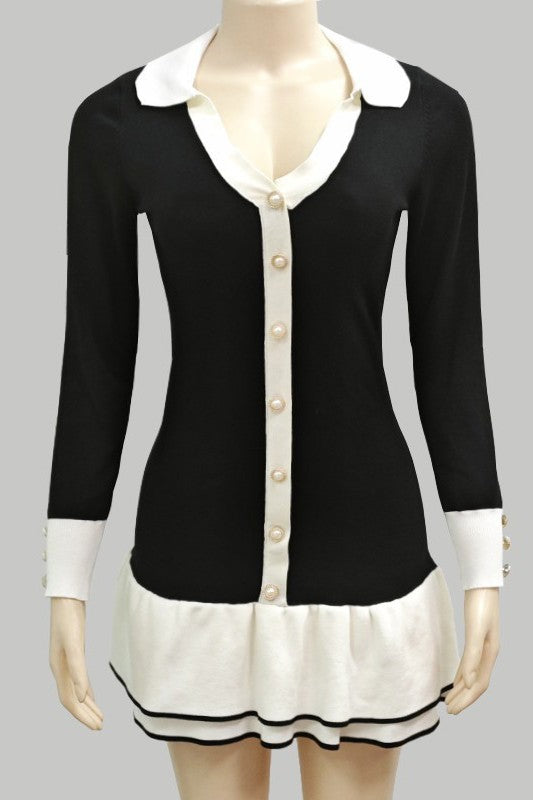 Black sweater mini dress front view, cream placket, long sleeves, and striped ruffle hem