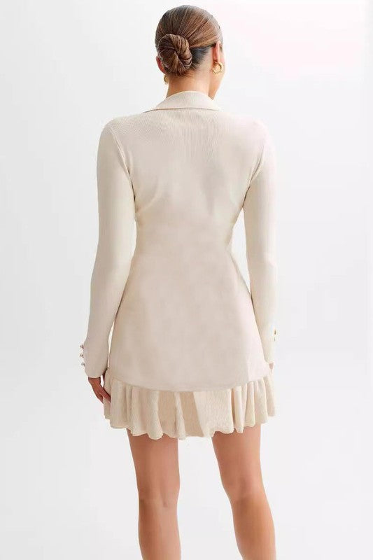 Cream sweater mini dress, back view with long sleeves and ruffled hem