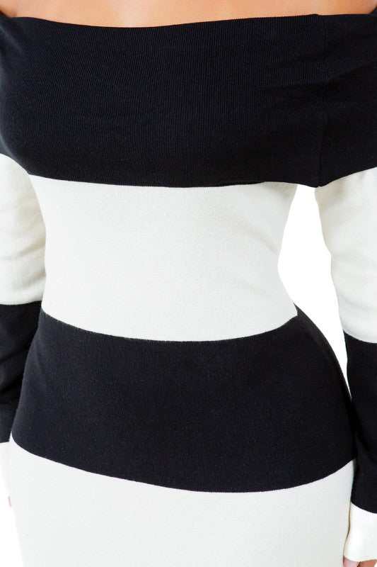 Close-up of black off-shoulder knit top with black-and-white horizontal stripes
