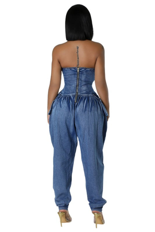 Back view: navy strapless denim jumpsuit with center back zipper and gathered waist