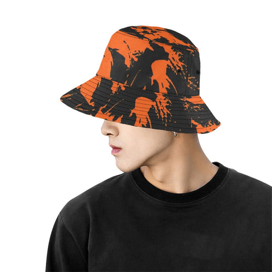 Black and orange graffiti bucket hat, side view with paint-splatter pattern and stitched brim