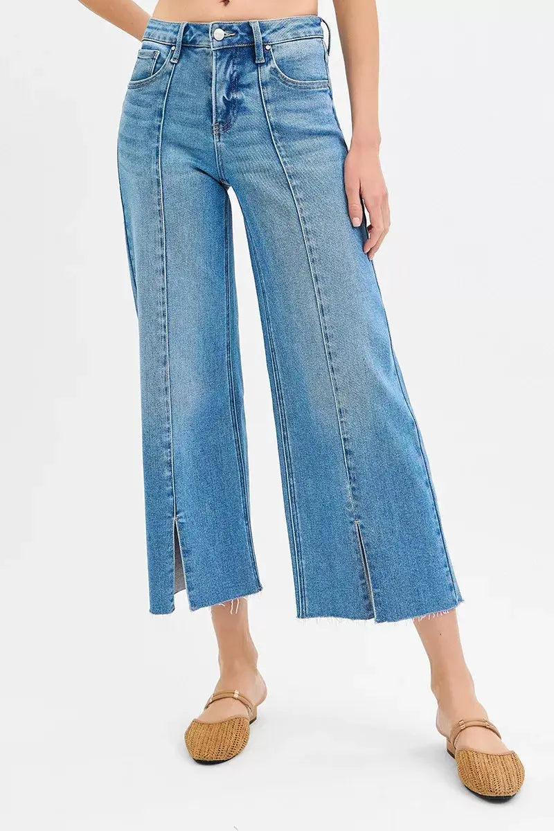 Medium-wash front view: wide-leg crop jeans with long front slit detail