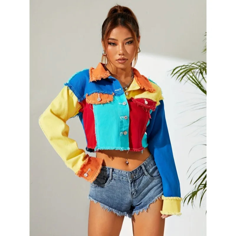 Patchwork denim jacket top paired with high-waist denim shorts; multicolor and frayed
