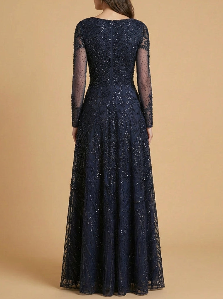 Back view of navy long sleeve high-neck gown with sequined bodice and sheer sleeves